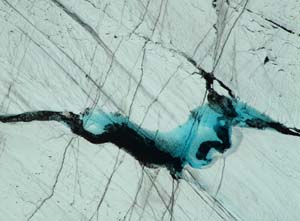 Lake on the cracked surface of Matanuska Glacier .. a piece of art