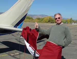 Ueli ready to cover the plane after returning to Boulder
